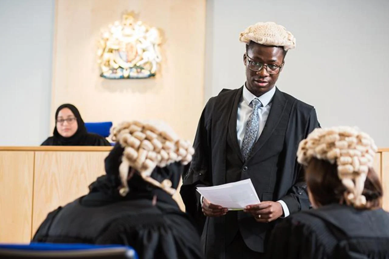 Law student advocate presenting in a courtroom before the bench